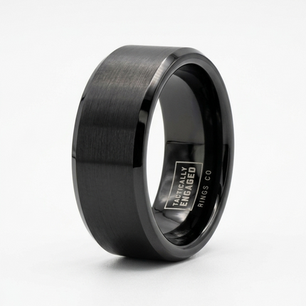 Black tungsten ring with a brushed finish on a white background