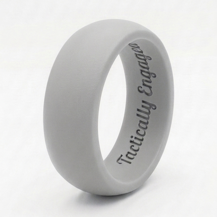 Gray silicone ring with 'Tactically Engaged' text on a white background