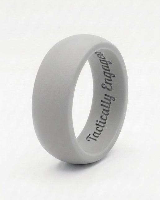 Gray silicone ring with 'Tactically Engaged' text on a white background