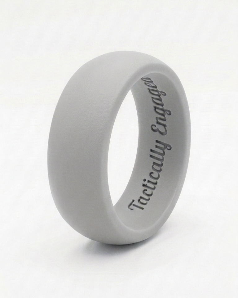 Gray silicone ring with 'Tactically Engaged' text on a white background