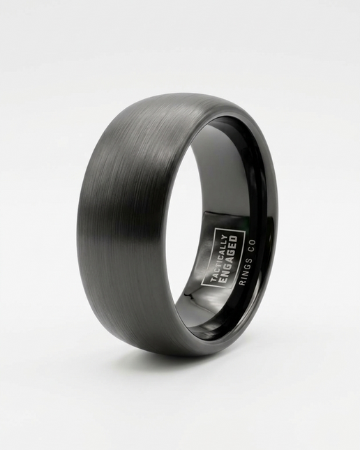 Black tungsten ring with a brushed finish on a white background