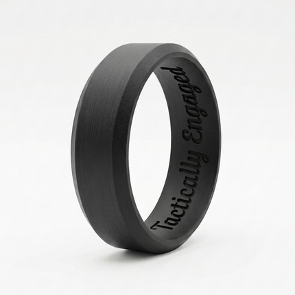 Black ring with 'Tactically Engaged' engraving on a white background