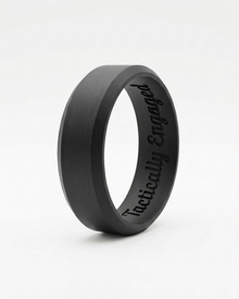 Black ring with 'Tactically Engaged' engraving on a white background